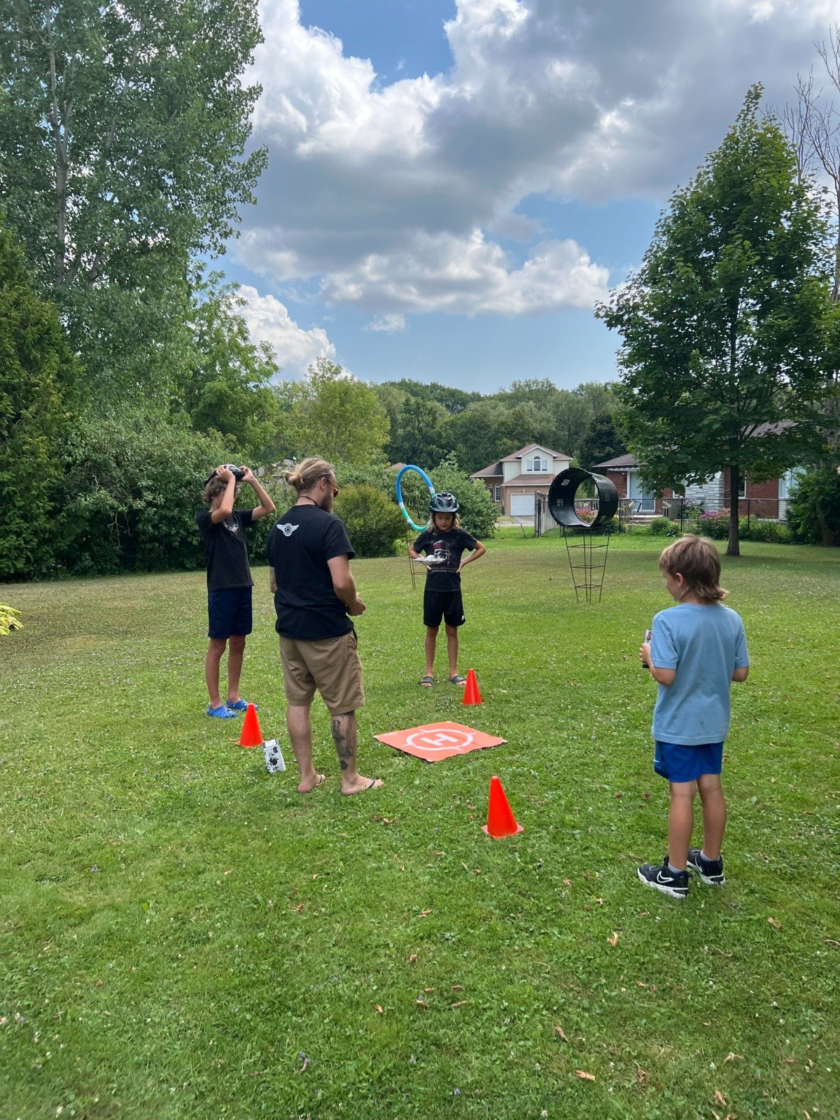 Drone camp activities with kids and obstacle equipment
